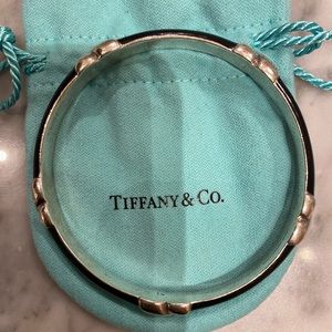 Signature x bracket by Tiffany&Co. used. Silver. Size 7 wrist.